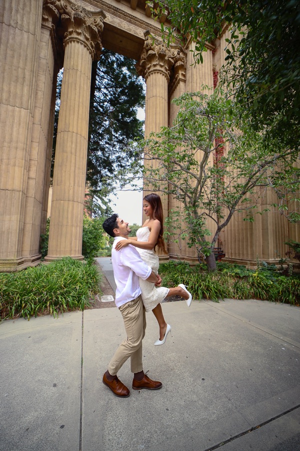 Juan Pablo lifting Trinique among tall stone columns